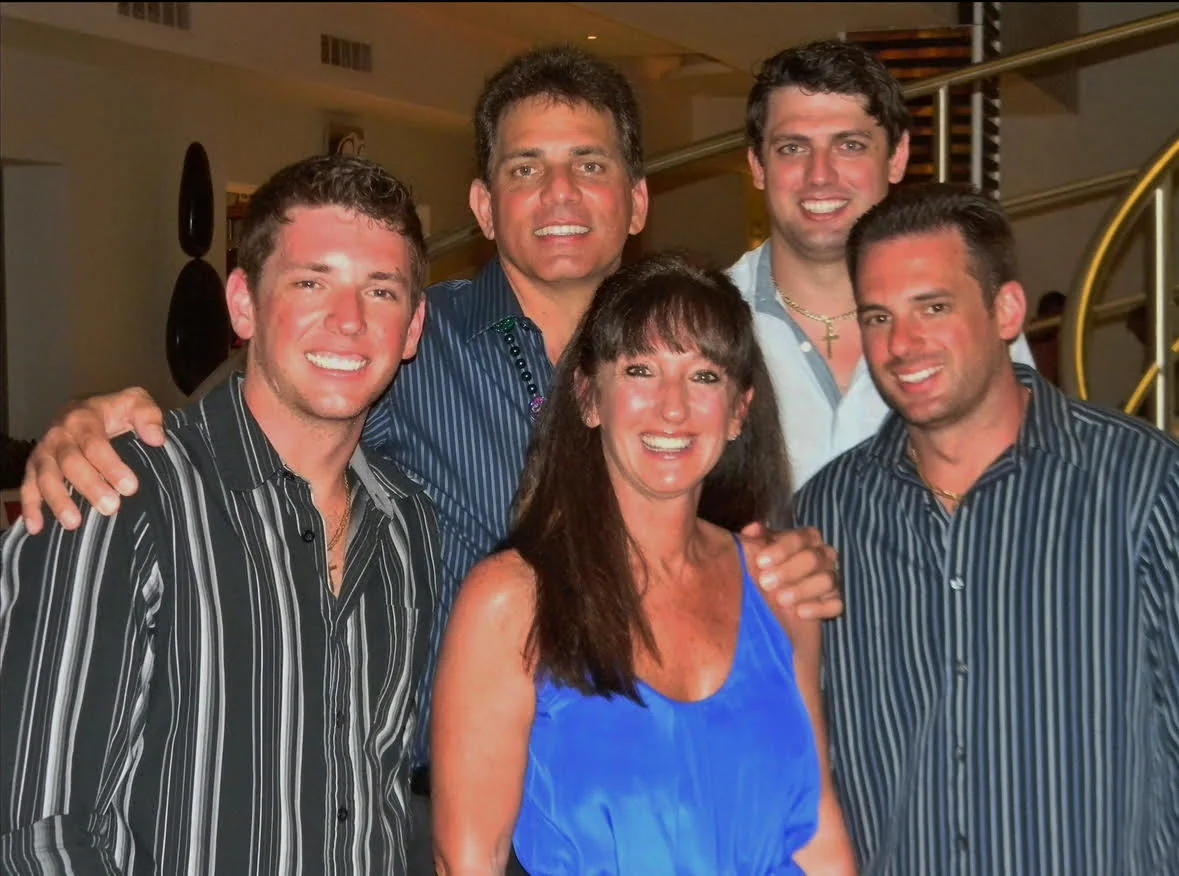 Joe Strada with his sons and their families gathered together for a portrait